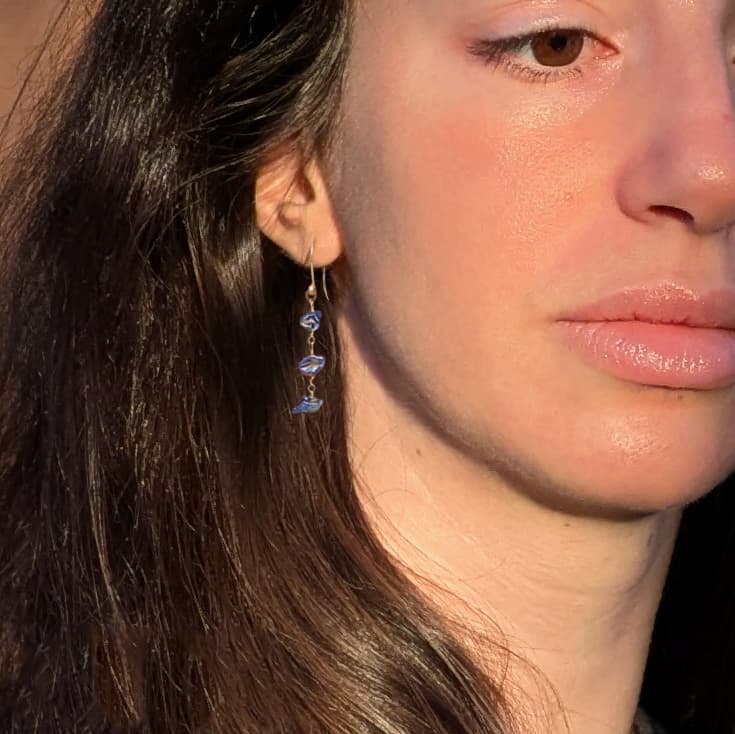Handmade gold earrings with peacock keshi pearls